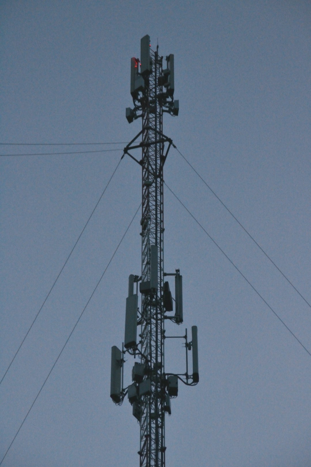 why-choose-us-02 a-tall-cell-tower-with-antennas-against-the-sky-yfvlqygmmyg